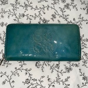 Like new Coach Audrey perforated  accordion zip wallet.